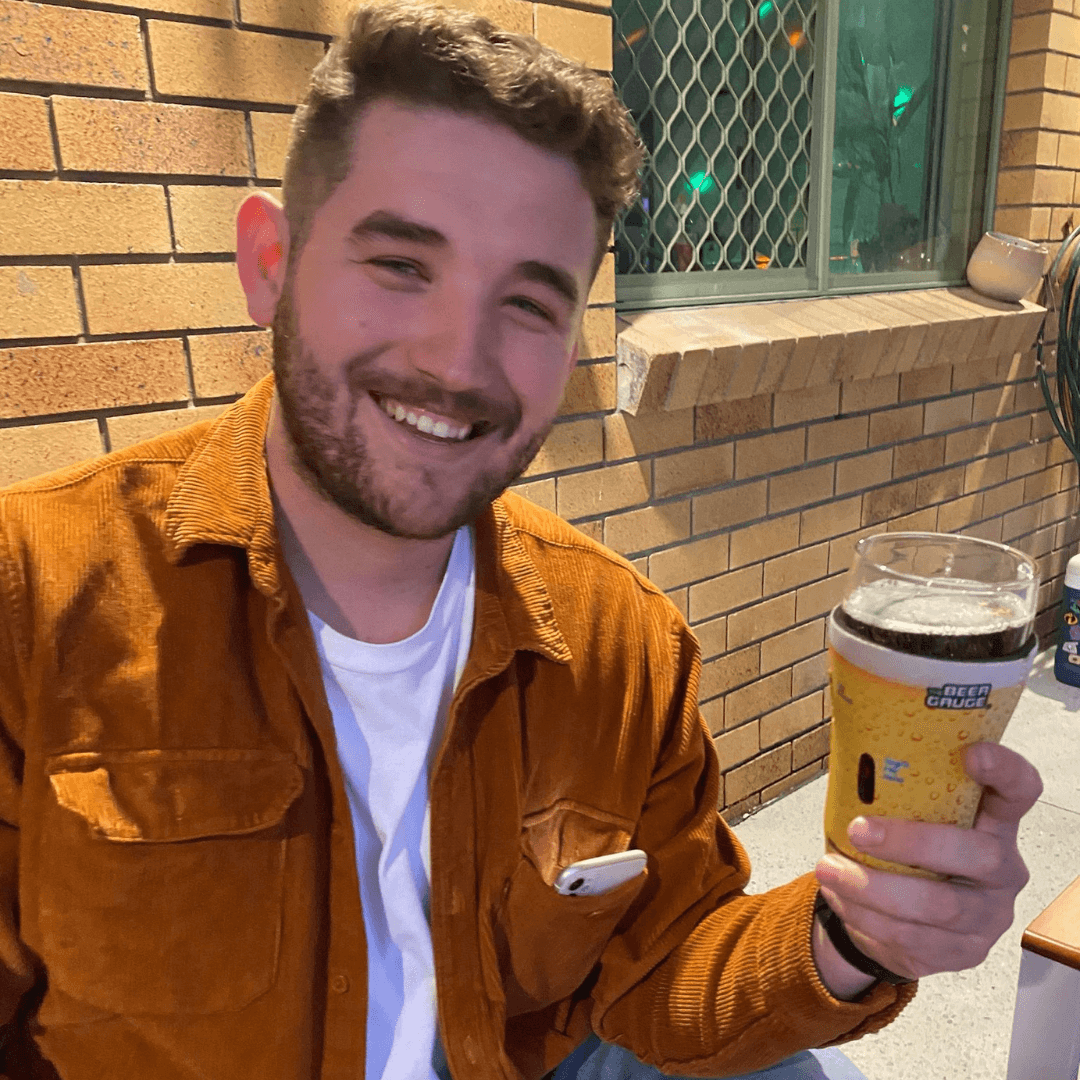 Man with yellow schooner glass stubby holder